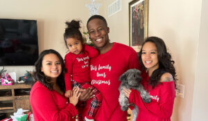 Military spouse, Tessarose, with her family dressed in matching holiday pajamas.