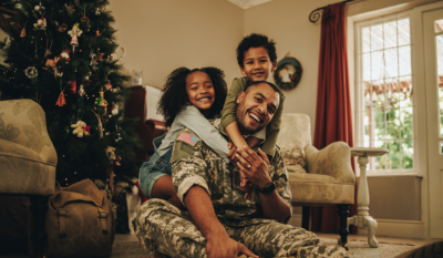 Military family reuniting home for the holidays with ASYMCA Operation Ride Home