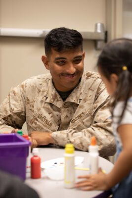 Military service member with his daughter at ASYMCA Operation Little Learner's class