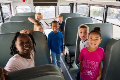 Military kids in a school bus on their way to ASYMCA youth program