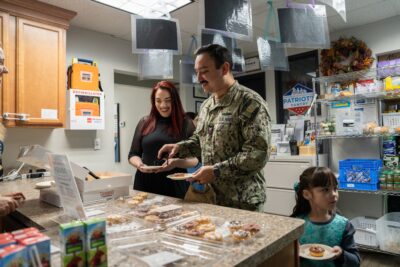 Military family enjoying a meal in the ASYMCA branch kitchen