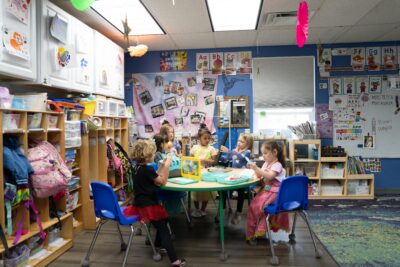 A group of military children in a classroom for ASYMCA pre-k program