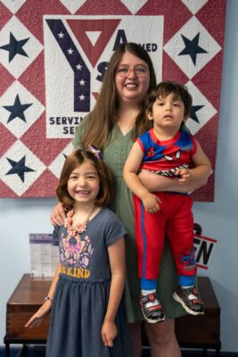 Military spouse with her children at an ASYMCA branch.