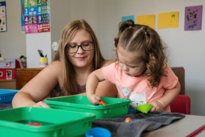 Military spouse with her child at ASYMCA pre-k program for military families