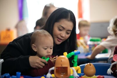 Military spouse with child at ASYMCA Operation Little Learners class