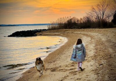 Military family on the beach enjoying the day